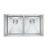 Stainless steel kitchen sink with two basins on a white background