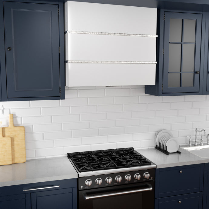 Modern kitchen with dark blue cabinets, white tiled wall, and black stove.