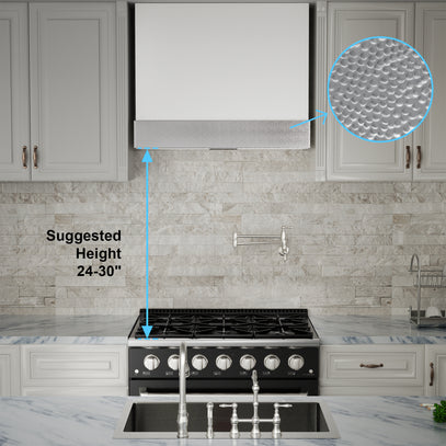 Stainless steel range hood above a kitchen stove with a close-up of the vent and text indicating height suggestions.