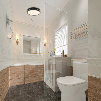 Modern bathroom with white toilet, sink, and vanity area.