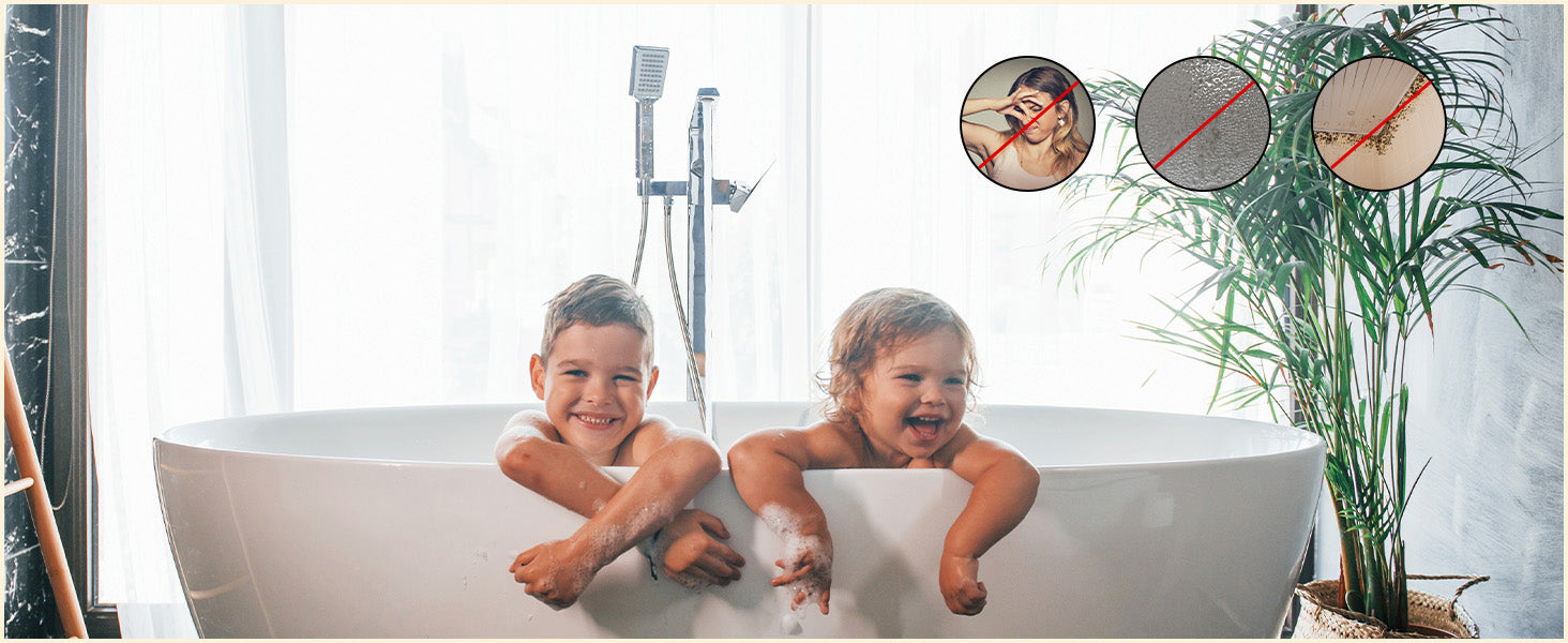 Two children in a bathtub with a plant and shower head in the background