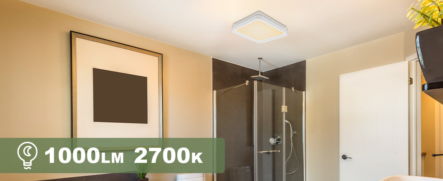Modern bathroom interior with a shower area, framed artwork on the wall, and a light fixture.