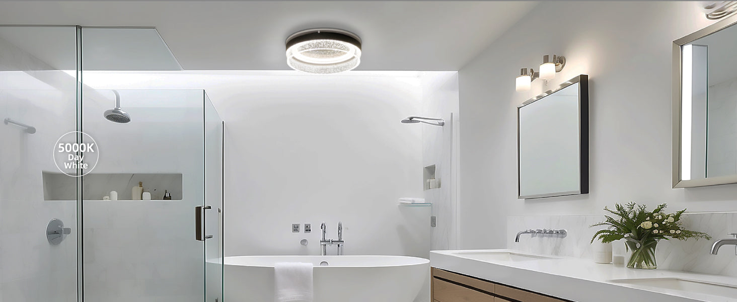 Modern bathroom with glass shower enclosure, bathtub, and vanity area.