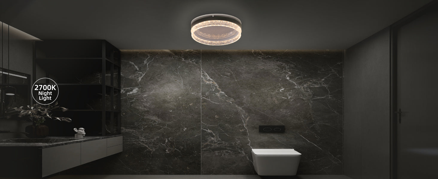 Modern bathroom with a ceiling light fixture and marble wall.