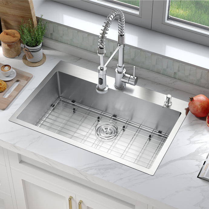 Stainless steel kitchen sink with faucet in a modern kitchen setting