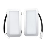 Two rectangular light fixtures with black wiring on a white background