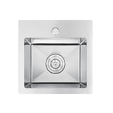 Stainless steel kitchen sink on a white background