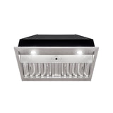 Stainless steel range hood with black top on a white background