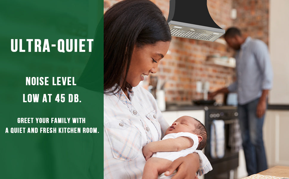 Woman holding a baby in a kitchen with text about an ultra-quiet range hood.