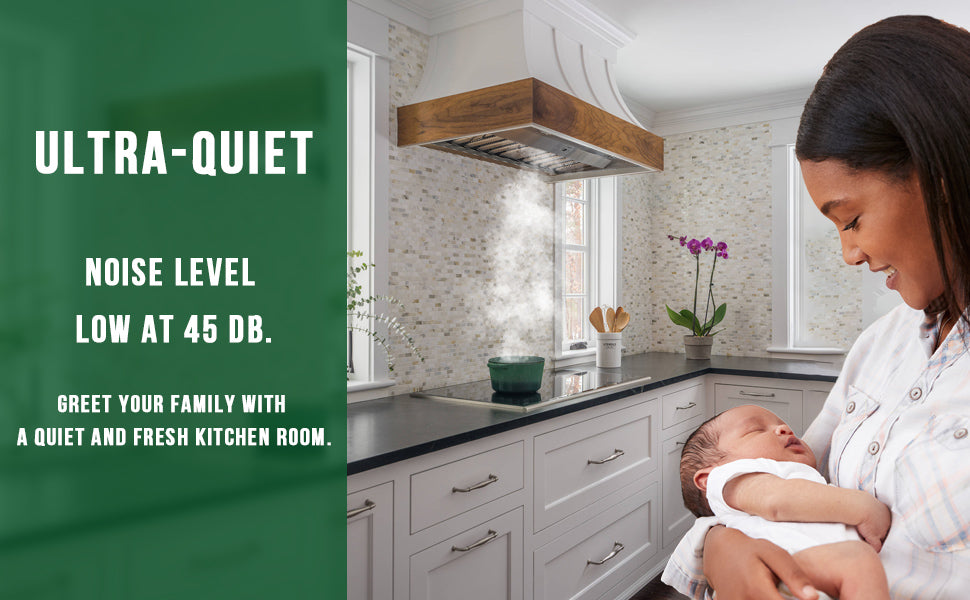 Woman holding a baby in a kitchen with text about ultra-quiet noise level