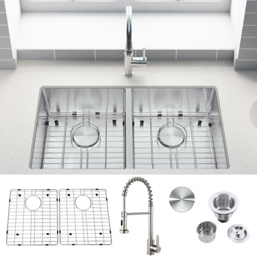Stainless steel kitchen sink with faucet and accessories on a white background