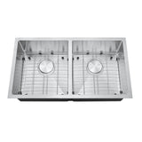 Stainless steel kitchen sink with grid on a white background