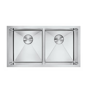 Stainless steel kitchen sink with two basins on a white background