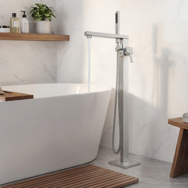 Modern freestanding bathtub with a shower system in a bathroom setting.