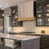 Modern kitchen with gray cabinets, marble countertop, and stainless steel appliances.