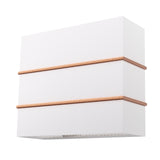White wall light fixture with gold accents on a white background