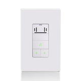 White wall switch with green indicator lights on a white background