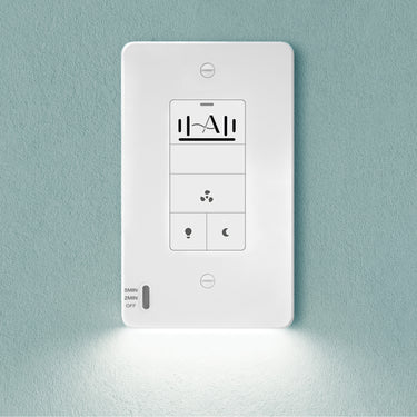 White electronic wall switch with control panel on a light blue wall