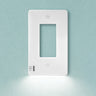 White light switch on a light blue wall