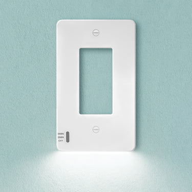 White light switch on a light blue wall