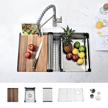 Kitchen sink setup with cutting board, fruits, and accessories on a white countertop.