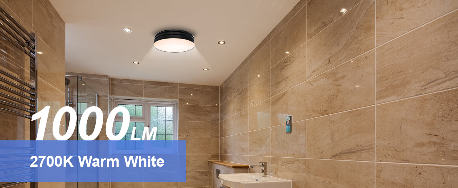 Bathroom interior with tiled walls and a light fixture, featuring text about light output and color temperature.