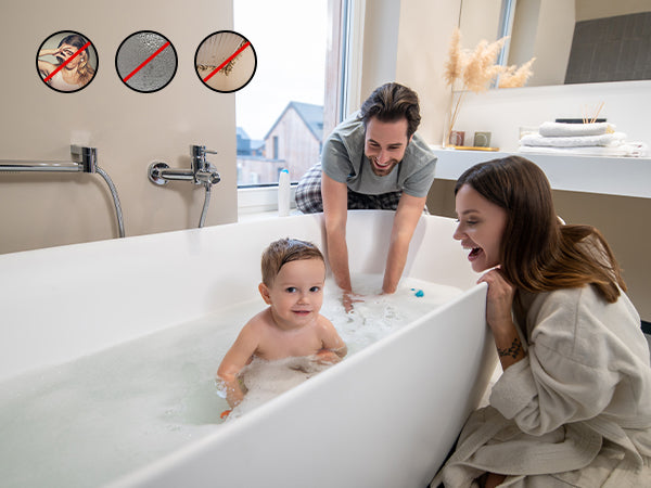Family in a modern bathroom with a child in a bathtub, parents interacting.