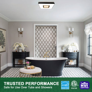 Modern bathroom with a freestanding bathtub, decorative elements, and certification logos at the bottom.