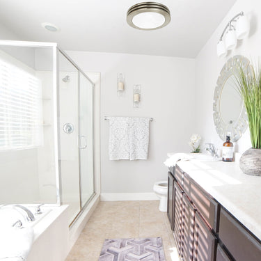 Modern bathroom with shower, sink, and vanity area.