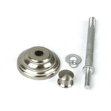Set of metal components including a large washer, smaller washer, and a long bolt on a white background