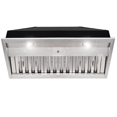 Stainless steel range hood with black top on a white background