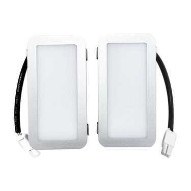 Two rectangular light fixtures with black wiring on a white background