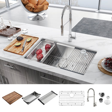 Stainless steel kitchen sink with accessories on a kitchen counter