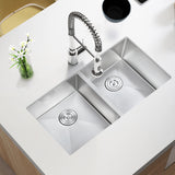 Stainless steel kitchen sink with faucet on a white countertop