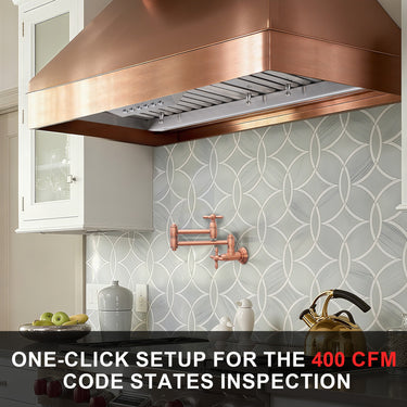 Kitchen with copper range hood and decorative wall tiles, featuring text about one-click setup for 400 CFM code states inspection.