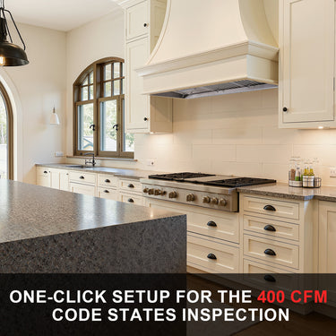 Modern kitchen with stainless steel appliances and granite countertops.