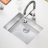Stainless steel kitchen sink with a modern faucet on a white countertop.