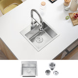 Stainless steel kitchen sink with faucet on a white countertop, accompanied by additional components.