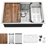 Stainless steel kitchen sink with wooden cutting board and accessories on a white background