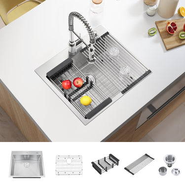 Stainless steel kitchen sink with faucet and drain rack on a white countertop.