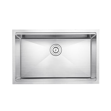 Stainless steel kitchen sink on a white background